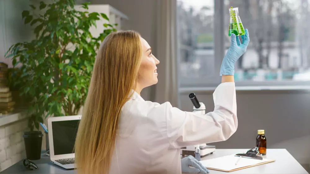 Female Researcher In The Laboratory Holding Test Tube