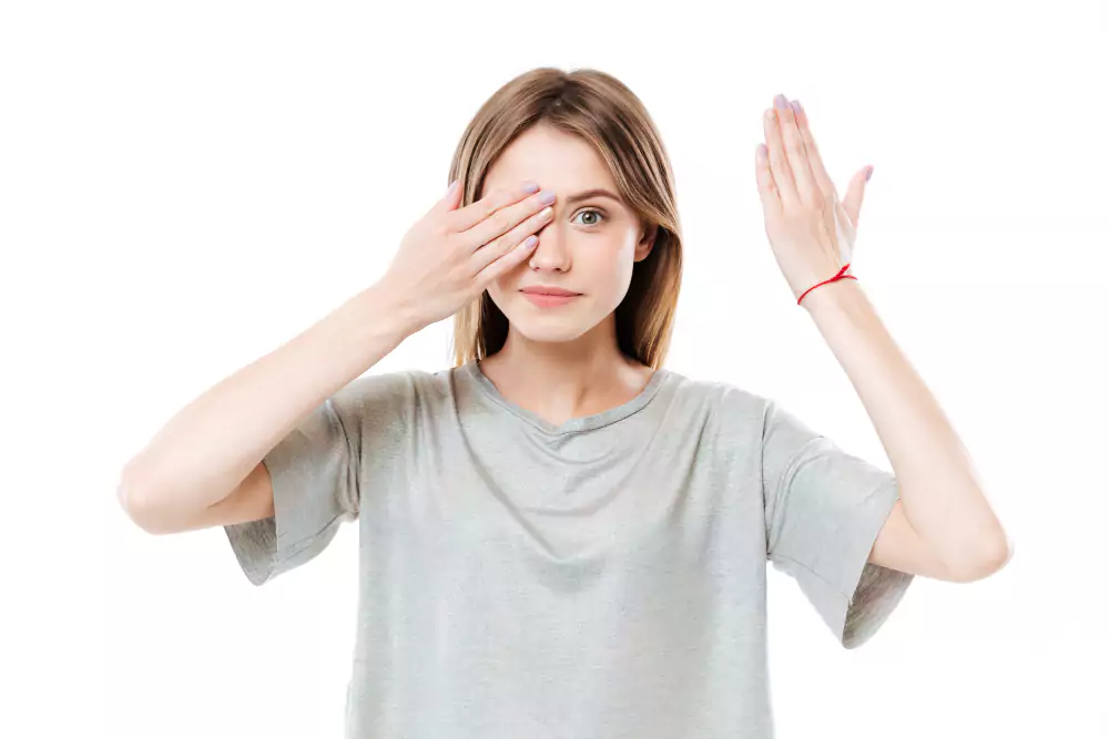 Girl Covering One Eye With Her Hand