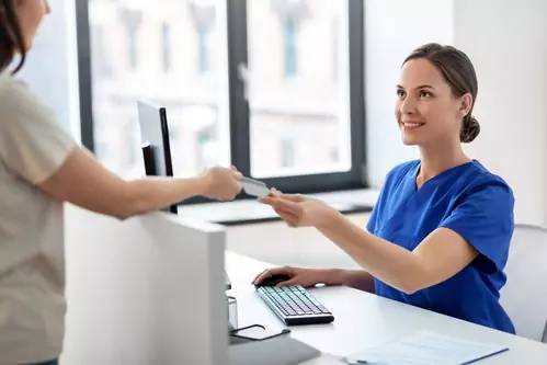 Medical Front Staff Take Payment Card