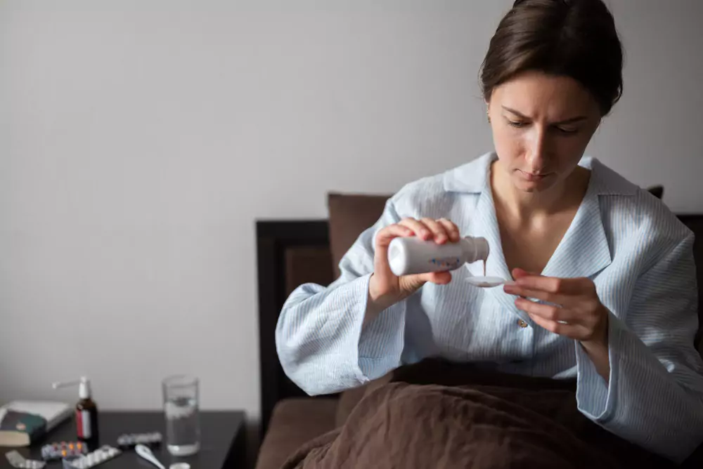 Woman Taking Medicine Bed