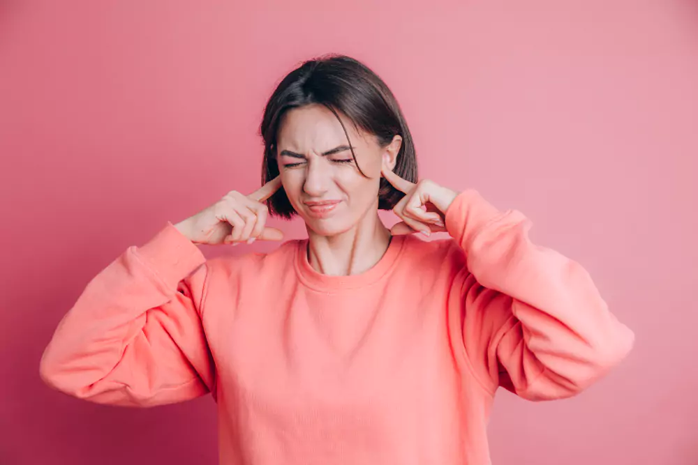 Woman Wearing Sweater Covering Ears